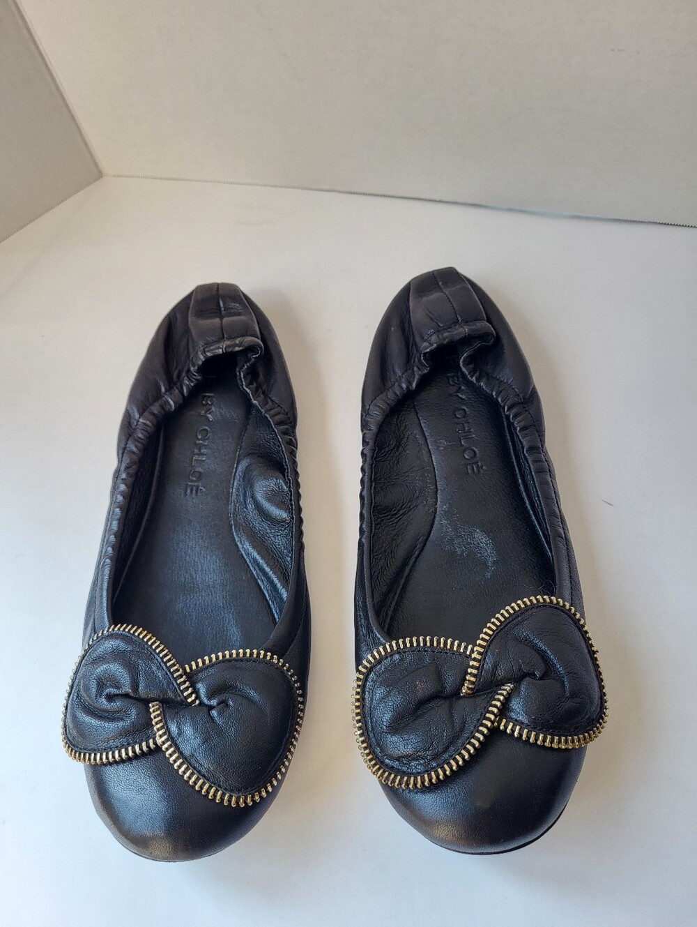 See By Chloe Black Leather Ballet Flats with Gold Zip-Trim Knot - Picture 4 of 14